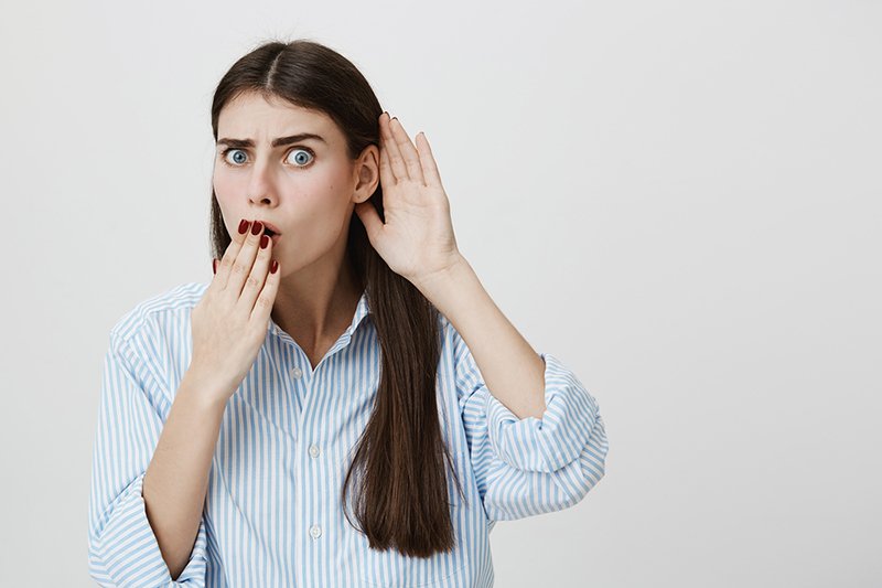 Woman covering mouth